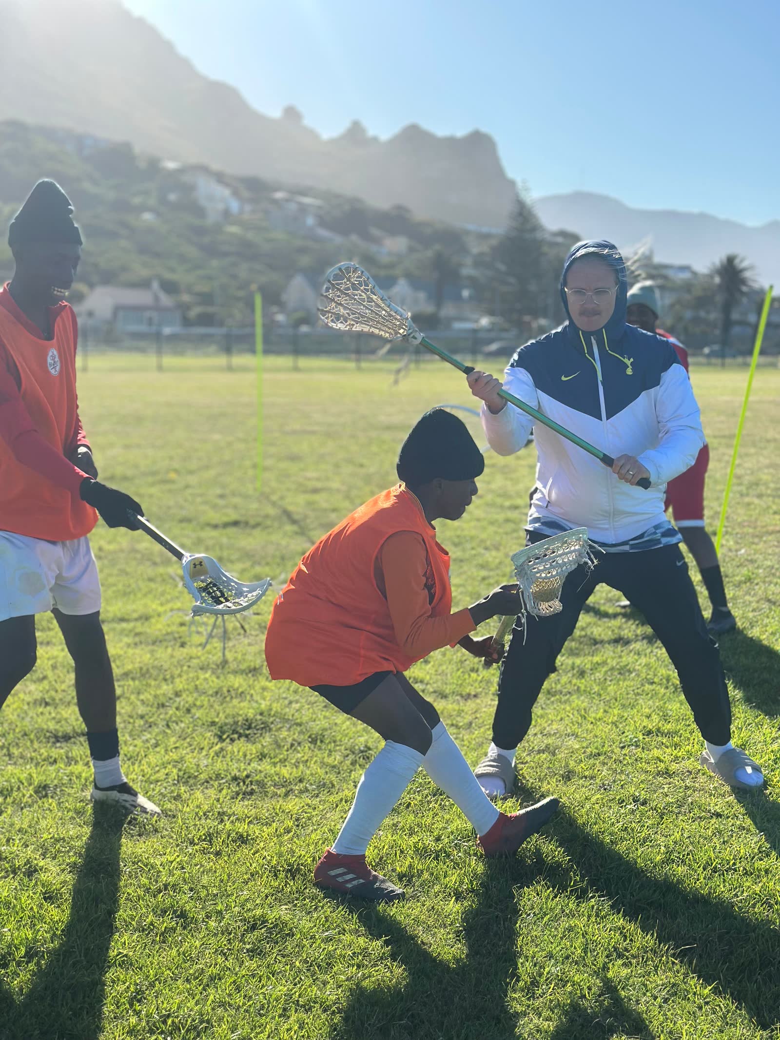 Players contesting a ground ball in Muizenberg