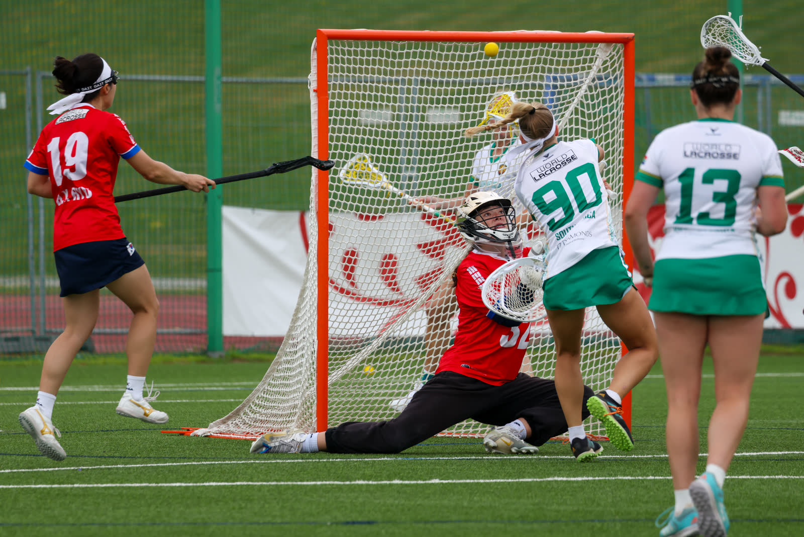 A South Africa player shooting on goal against Korea